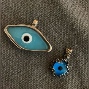 Two evil eye pendants